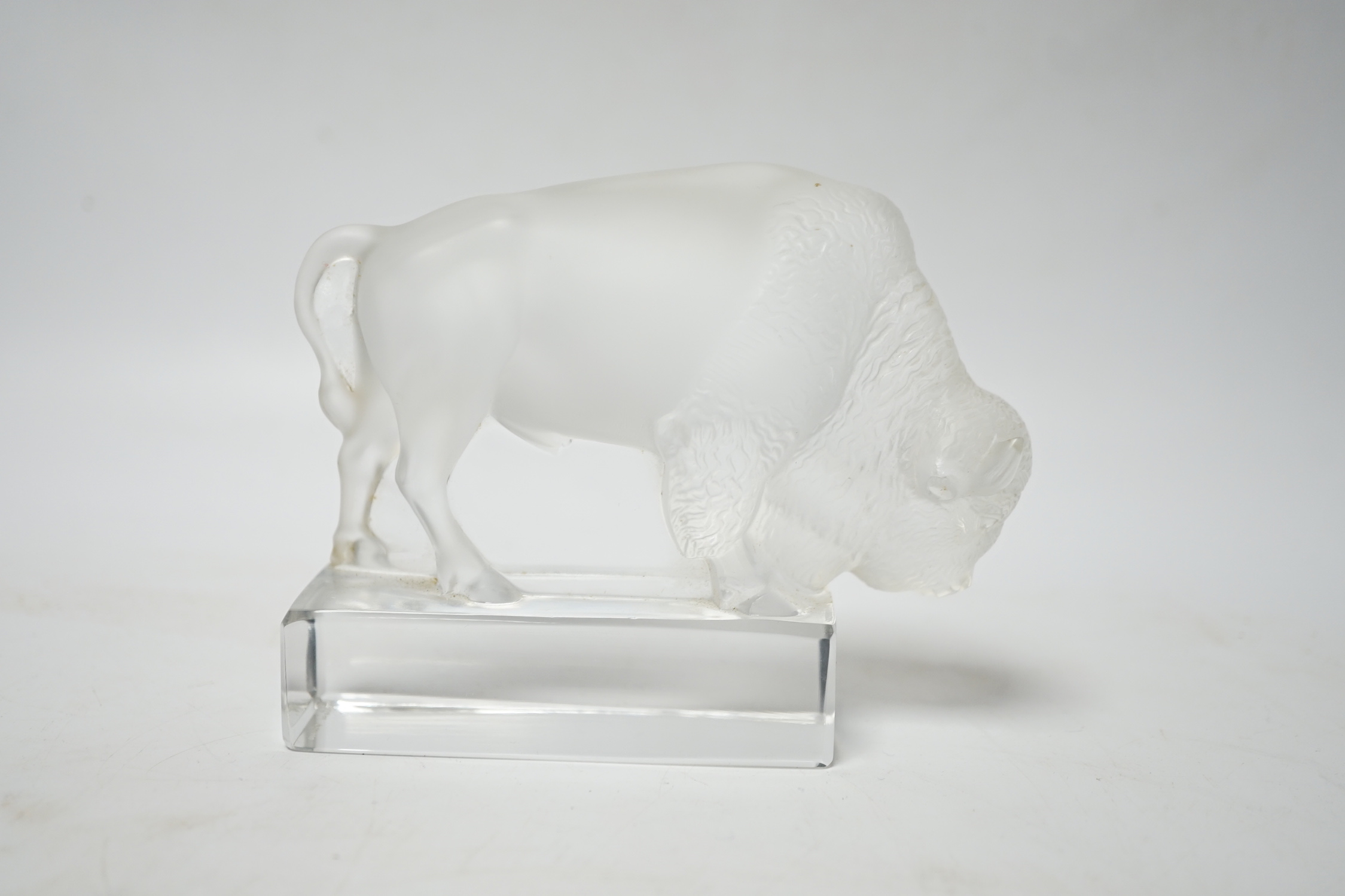 Rene Lalique, a frosted glass paperweight modelled as a bison, signed ‘Lalique France’ to base 12.5cm wide